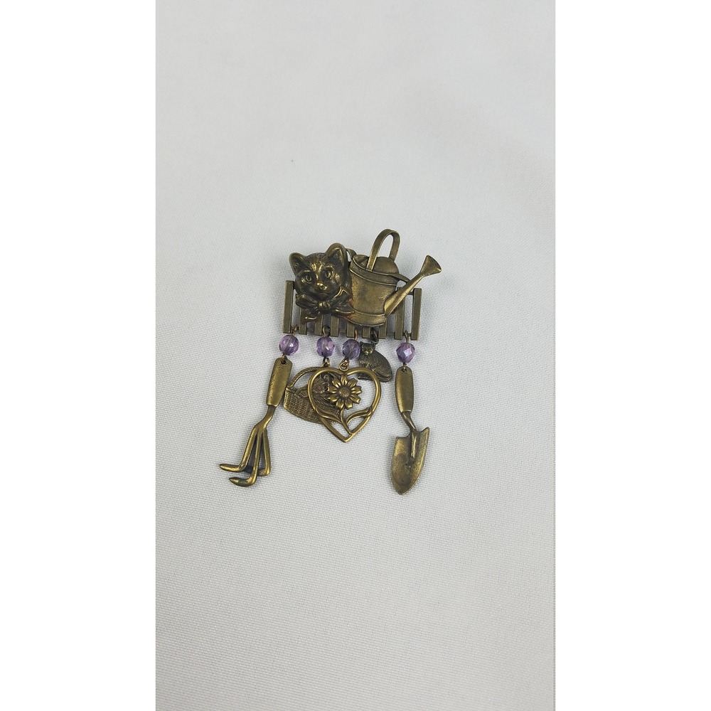 Vintage JJ brooch pin gold tone cat head on fence gardening tools